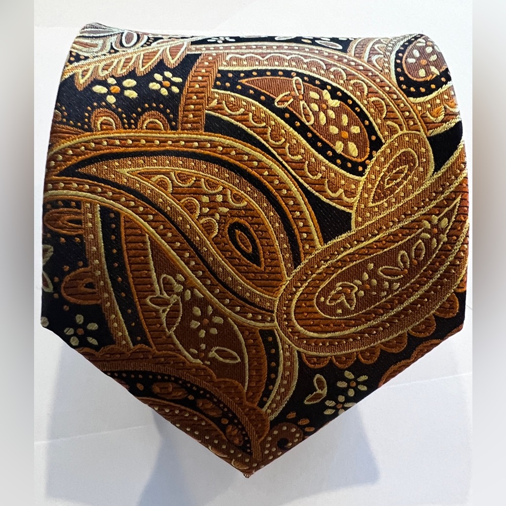 Gold and black tie, pocket square and cuff link set.